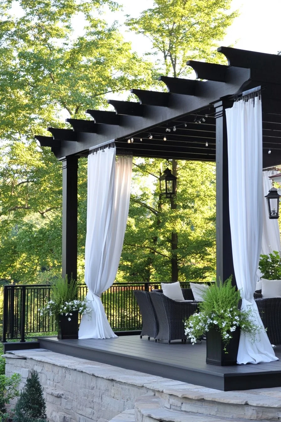 Deck with Black Pergola and Curtains